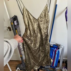 Tie back gold mini dress from Zara in europe